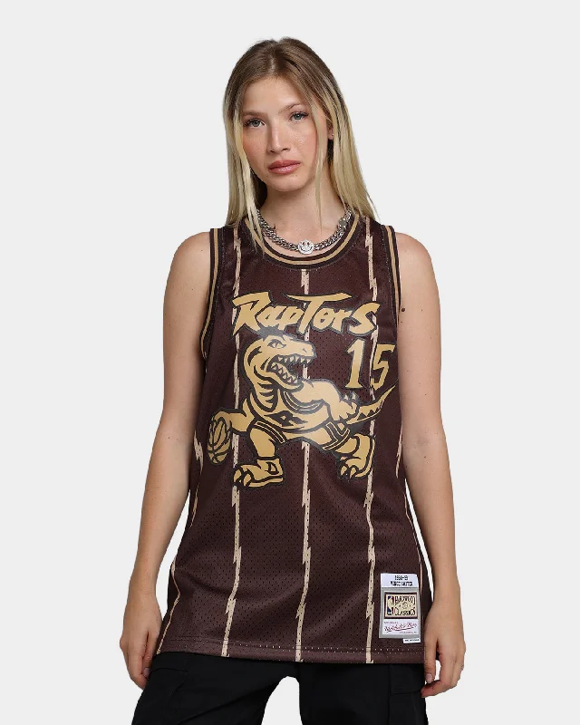 Mitchell & Ness Toronto Raptors Vince Carter #15 '98-'99 Lux Brown Swingman Jersey Baroque Brown Round Neck Jersey Tee Mitchell & Ness Toronto Raptors Vince Carter #15 '98-'99 Lux Brown Swingman Jersey Baroque Brown Round Neck Jersey Tee